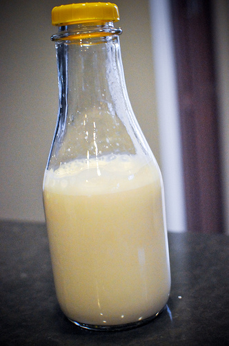 A glass bottle of homemade almond milk
