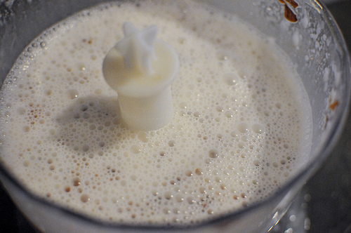 Frothy almond milk in a food processor