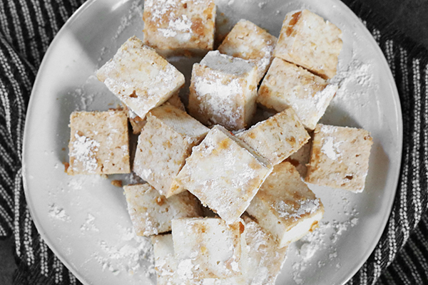 toss tofu in flour