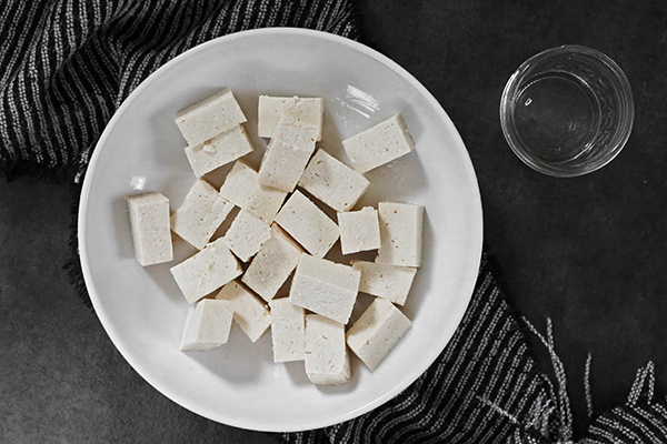 toss tofu in oil