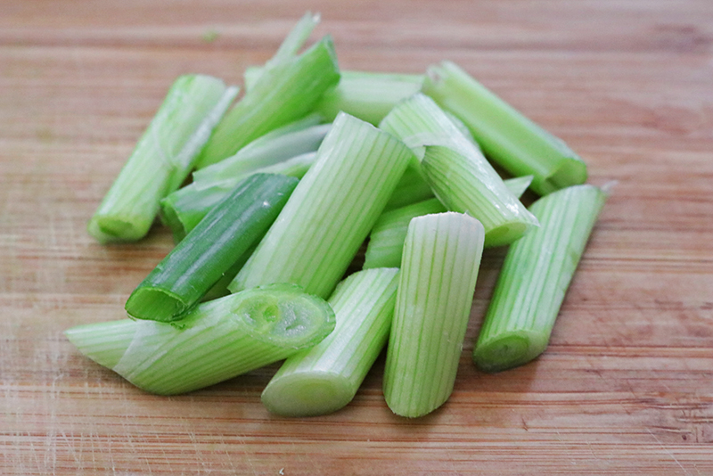 a pile of cut green onions