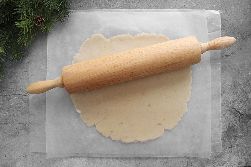 rolling out sugar cookie dough with a rolling pin