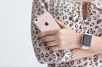 Woman With Apple Watch Holding Iphone