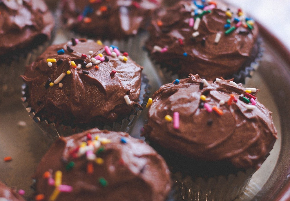 Chocolate frosted cupcakes with rainbow sprinkles