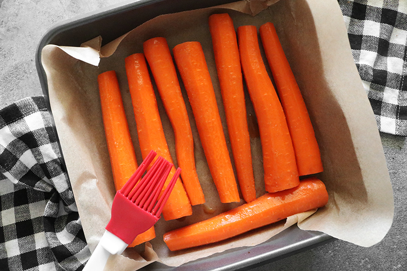 carrots in a pan with parchment paper