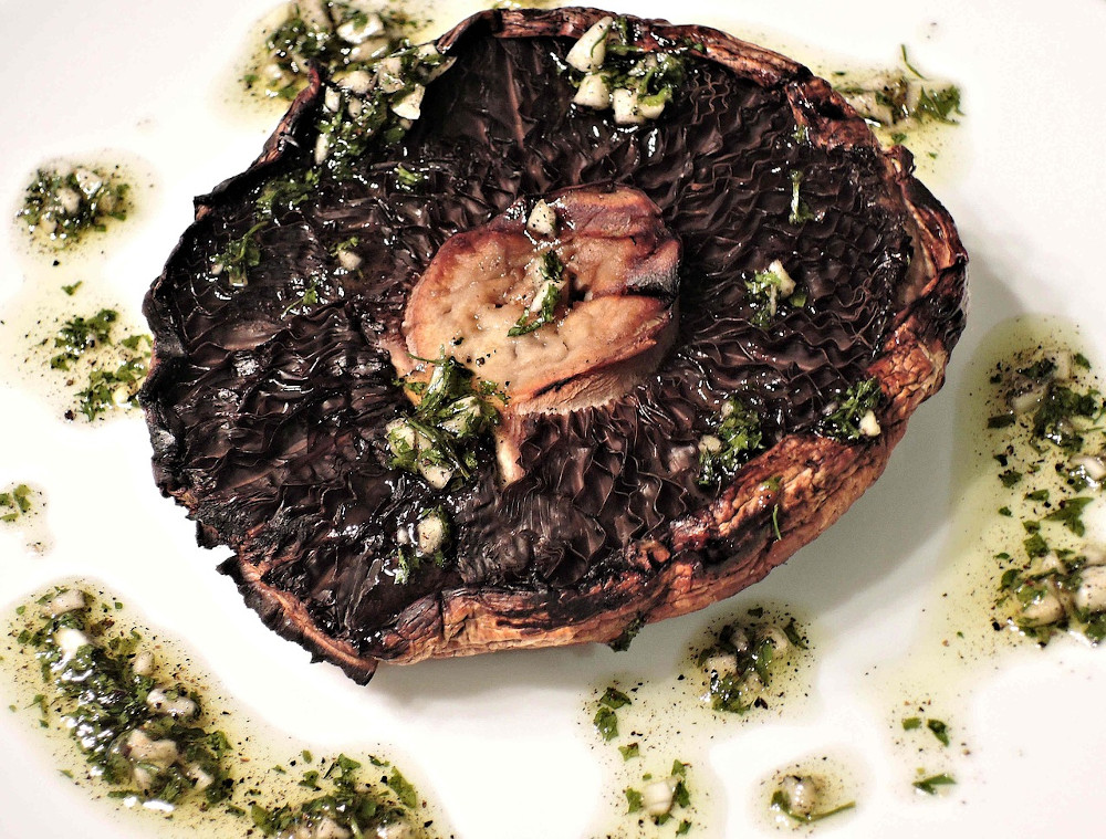 Grilled portobello mushroom with garlic, olive oil, and parsley