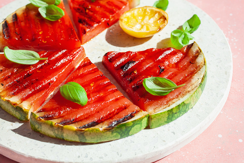 Grilled watermelon slices with lemon and basil