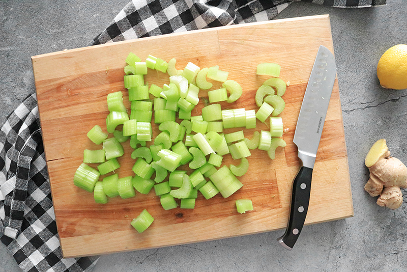 chopped celery on a cutting board