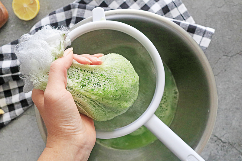 Squeezing out cucumber juice from the cheesecloth