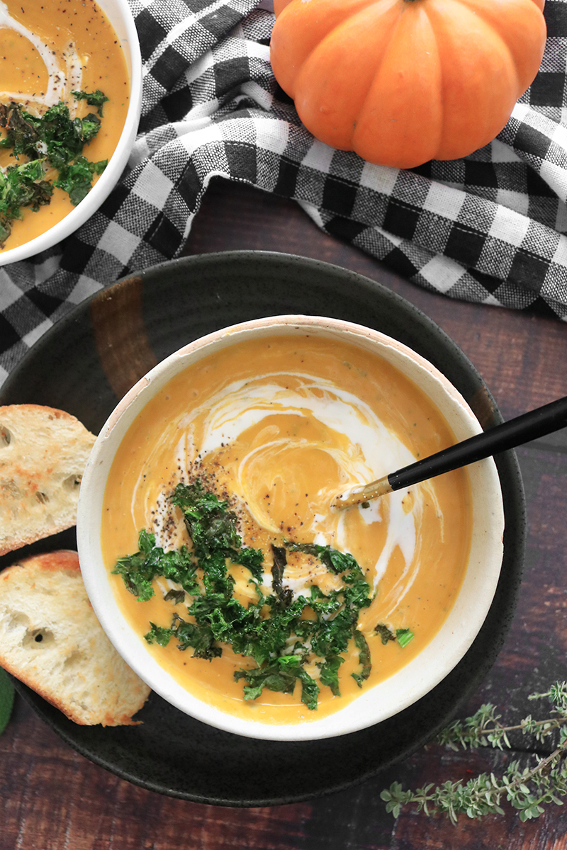 completed pumpkin soup served with bread