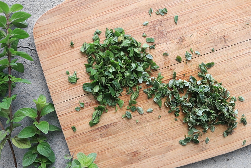 Chopped herbs on a cutting board