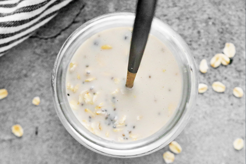 Mixing ingredients for Overnight Oats in a jar