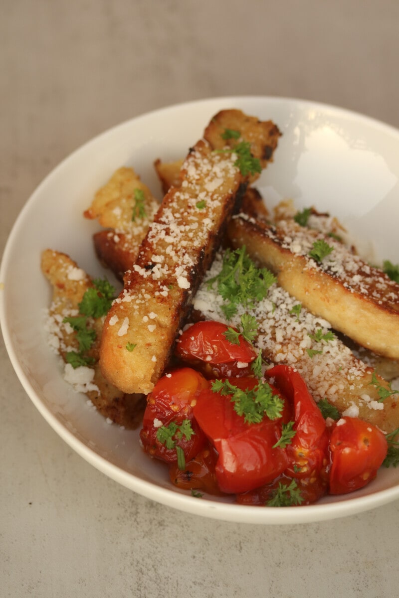 savory french toast sticks served with parmesan, parsley and fried tomatoes