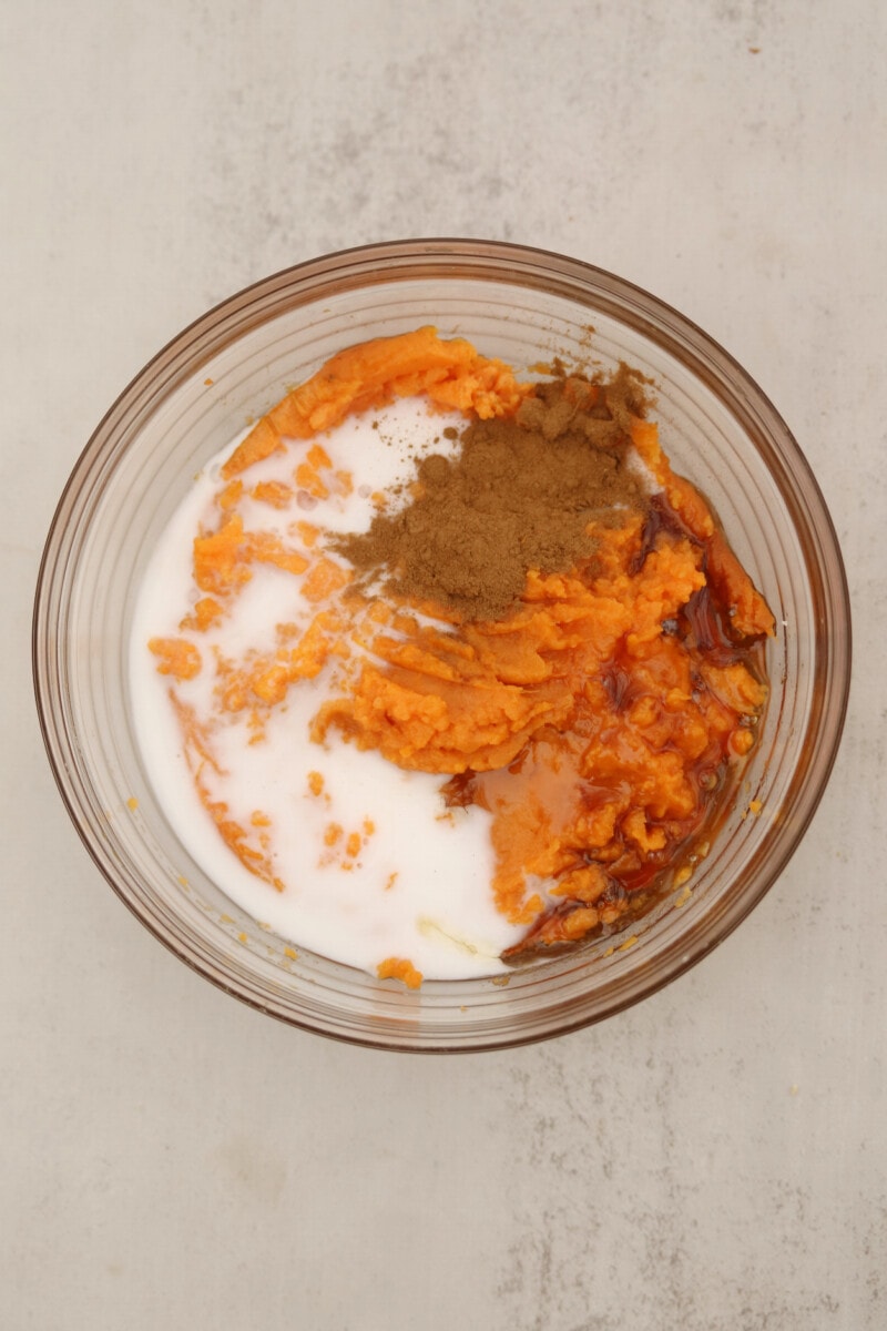 Vegan mashed potatoes with non dairy milk, spices, and maple syrup in a bowl.