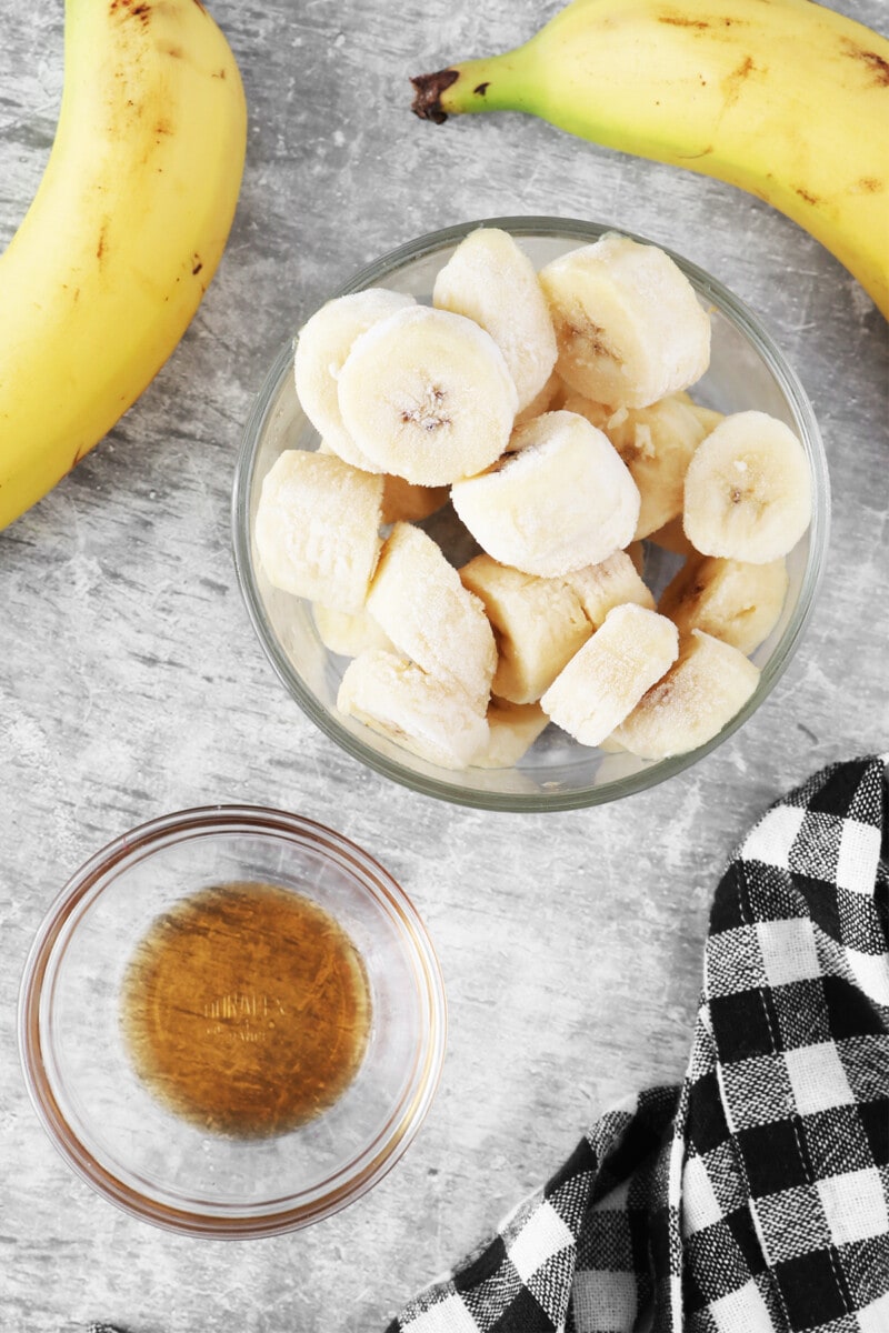 Bananas and a bowl of maple syrup.