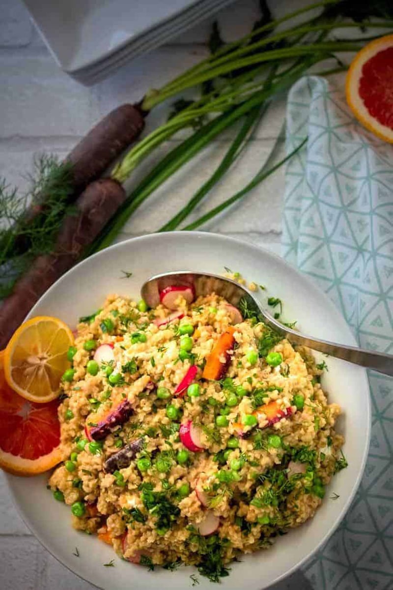 Spring freekeh salad with green peas on a plate.