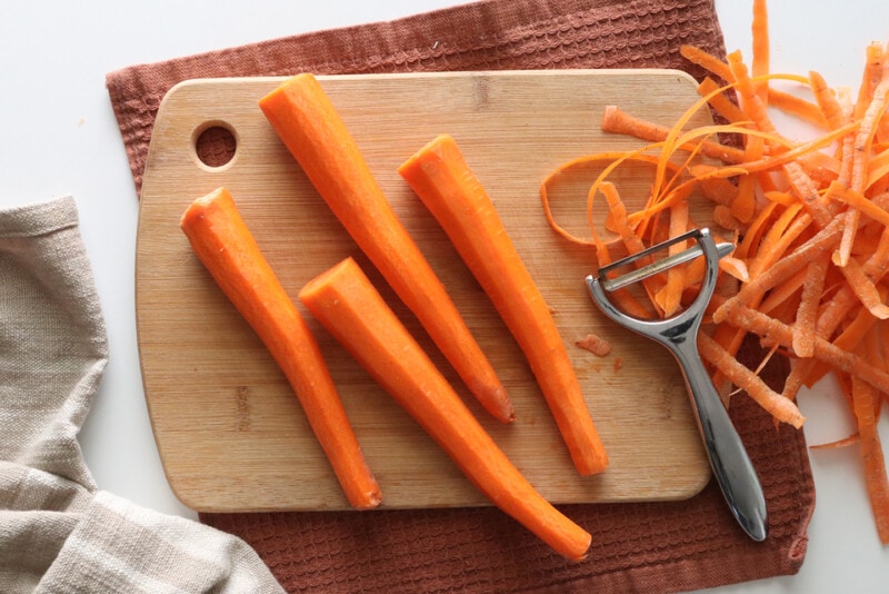 Peeling carrots for vegan bacon