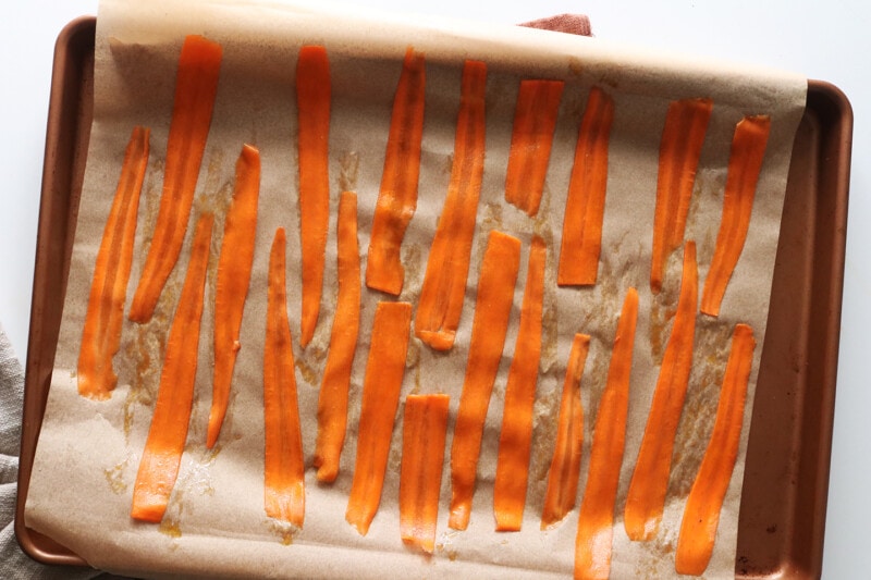 Carrot bacon on baking sheet