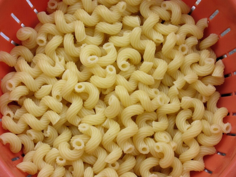 Cavatappi pasta in a collander.