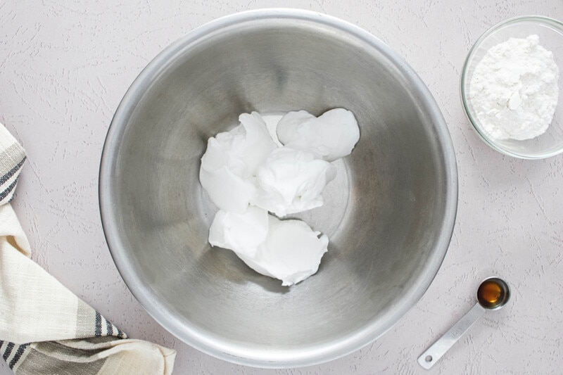 Thickened coconut milk in a large mixing bowl.