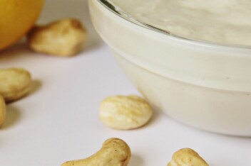 Vegan sour cream made with cashews and lemon in a small bowl.