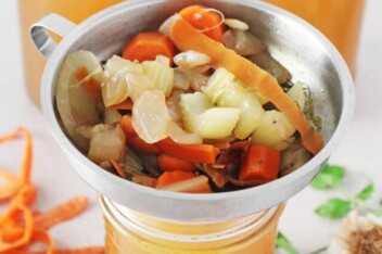 Vegan vegetable broth in glass jars