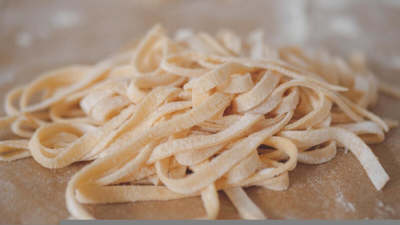 Fresh, uncooked Fettuccine pasta.