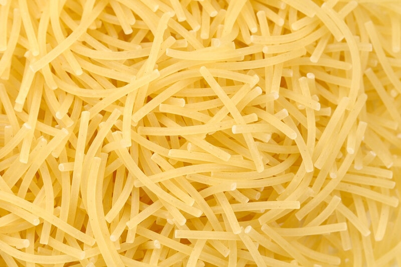 Close-up view of uncooked fideo pasta.