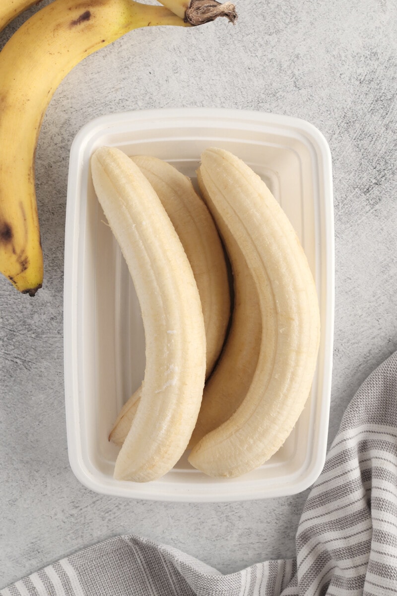 whole frozen bananas in an airtight container