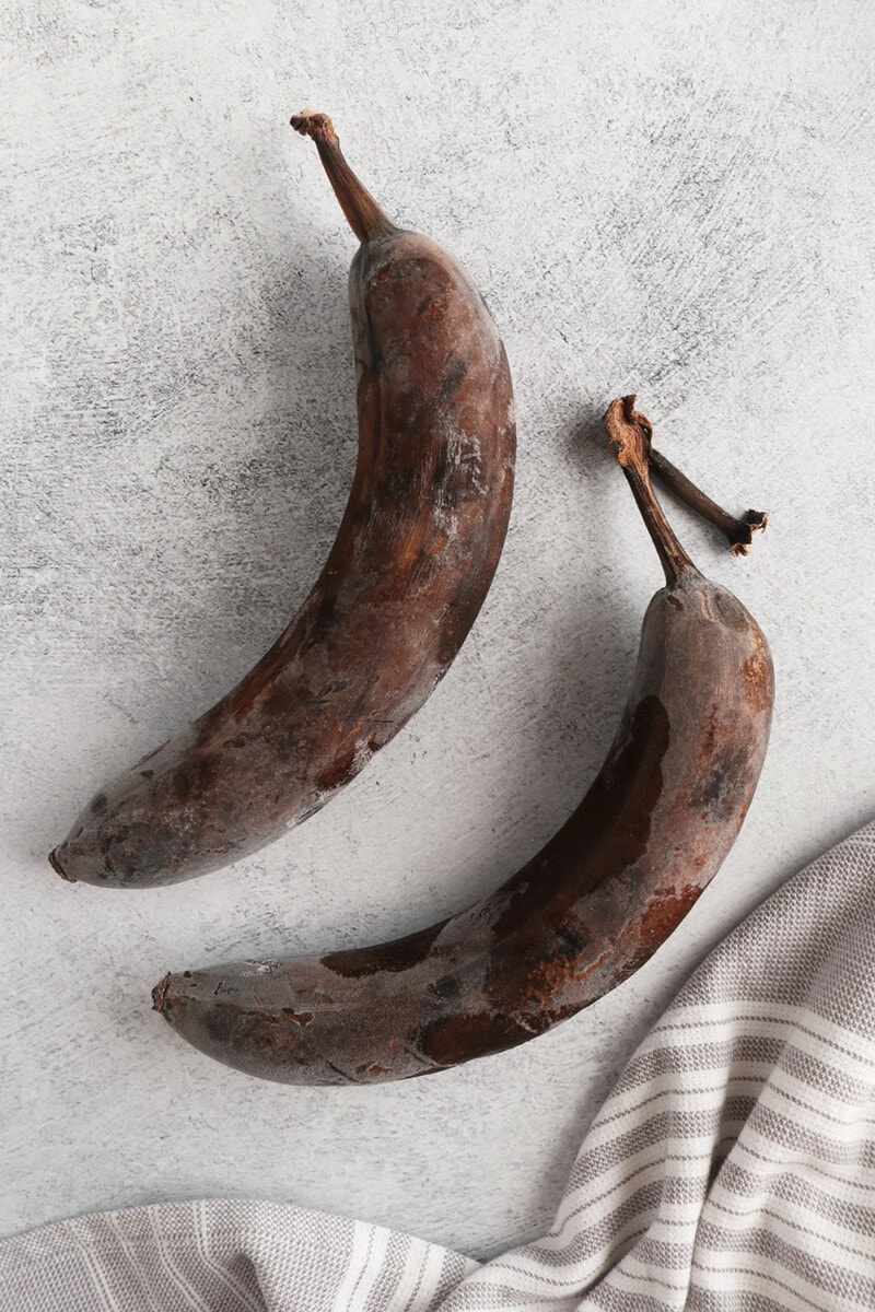 frozen brown unpeeled bananas