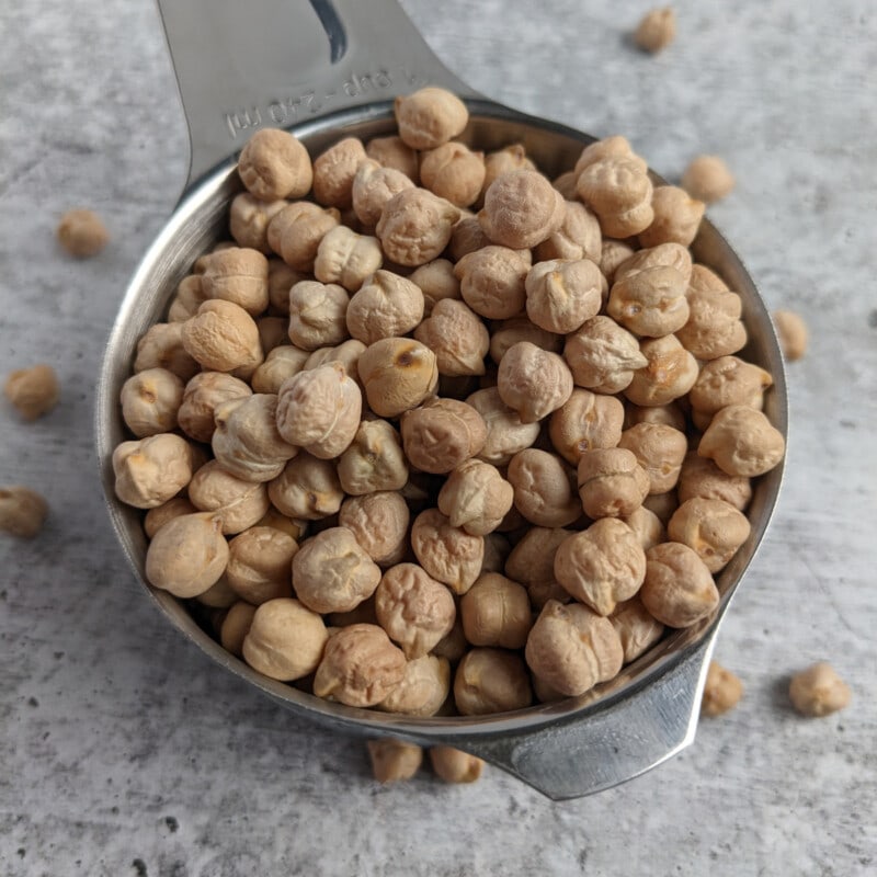 Dry Chickpeas in a measuring cup.