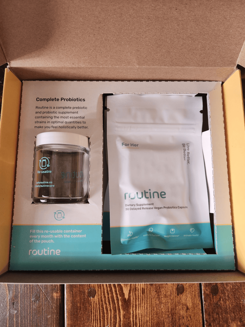 Routine probiotics for women packaging with a reuseable glass jar and pouch.