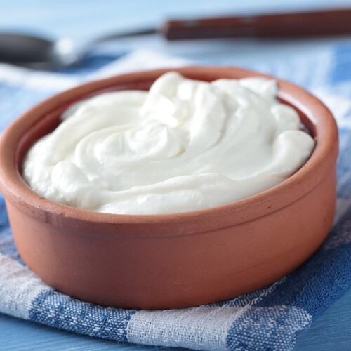 Creamy vegan Greek yogurt in a small bowl.