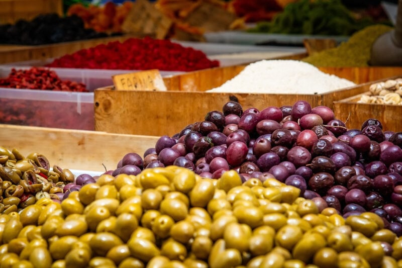 Different types of olives at a market.