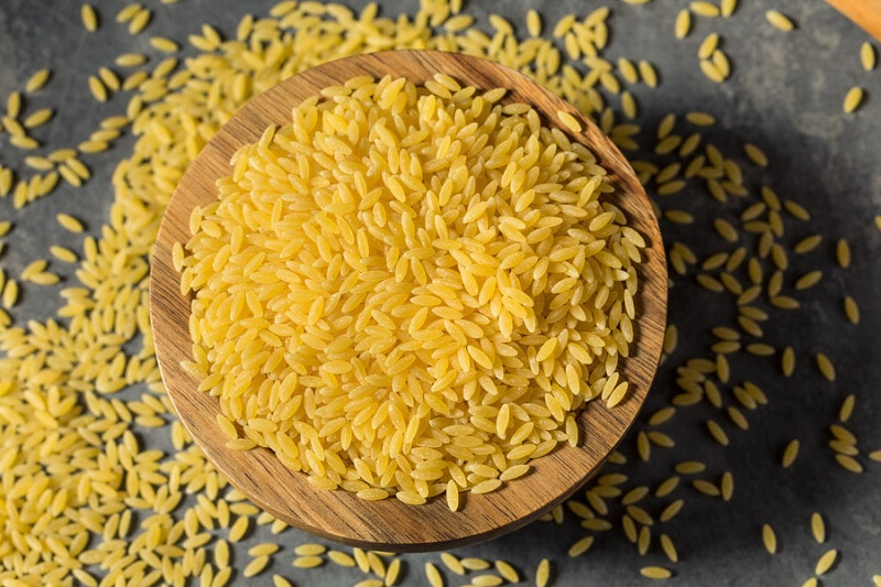 Uncooked Orzo Pasta in a Bowl.