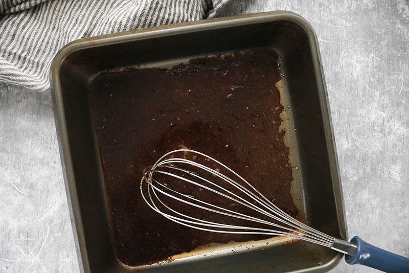 mixing ingredients in a pan with whisk