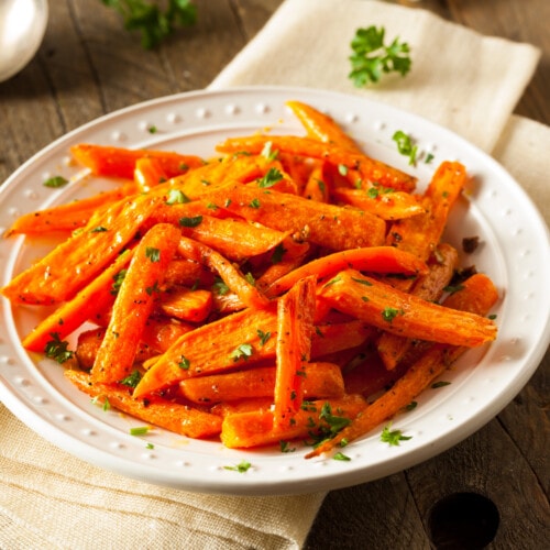 Roasted carrots on a white dish