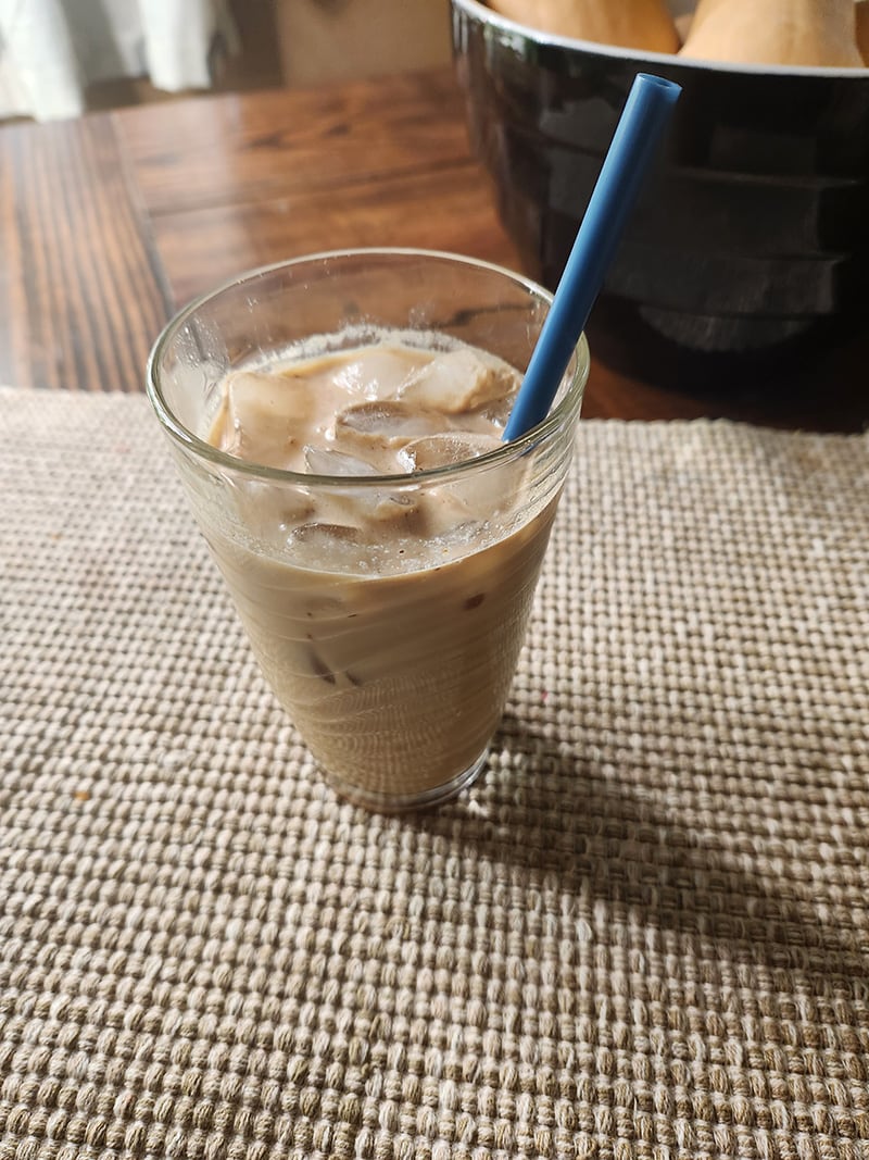 Ryze Mushroom Coffee iced coffee in a tall glass.