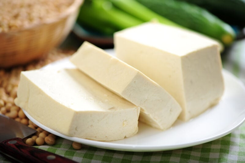 Blocks of sliced tofu on a white plate