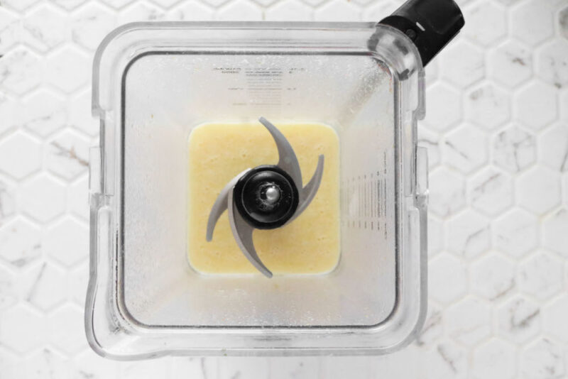 vegan butter ingredients in a blender on a white surface