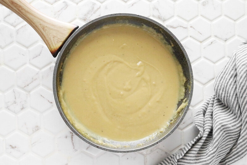 thickened vegan cheese sauce in a skillet