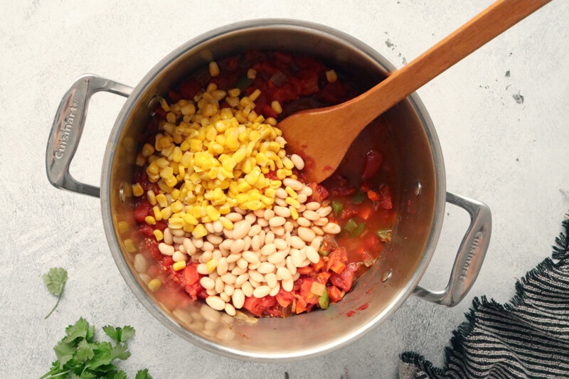 Add diced tomatoes, beans, and corn to chili