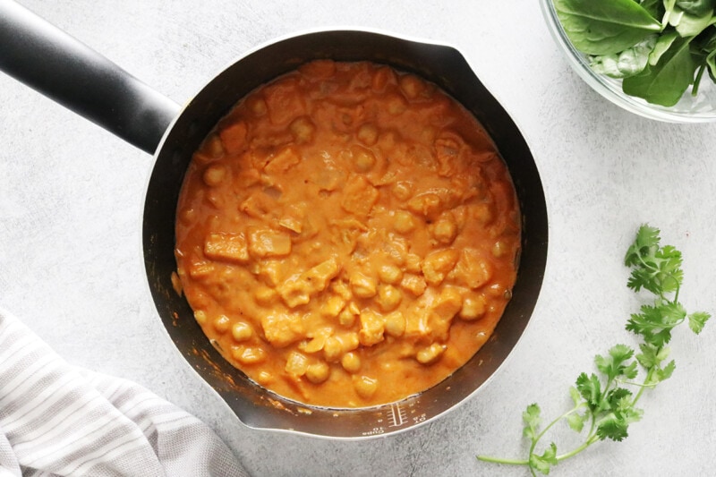 Stir and simmer uncovered for 20 to 30 minutes, or until the liquid is thick and the sweet potatoes are easily pierced with a fork.