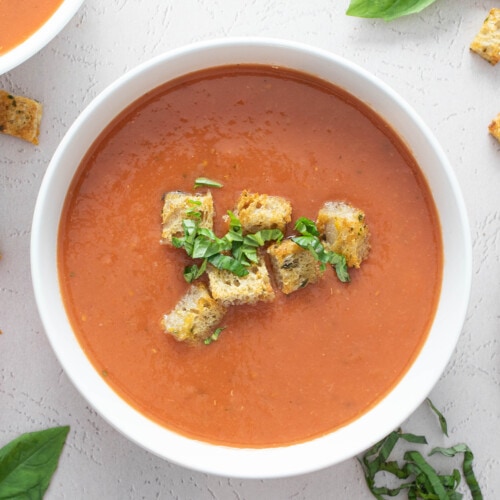 Vegan tomato soup in a white bowl