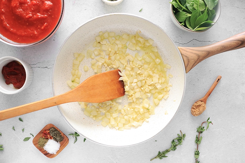 sautéing onions in a frying pan