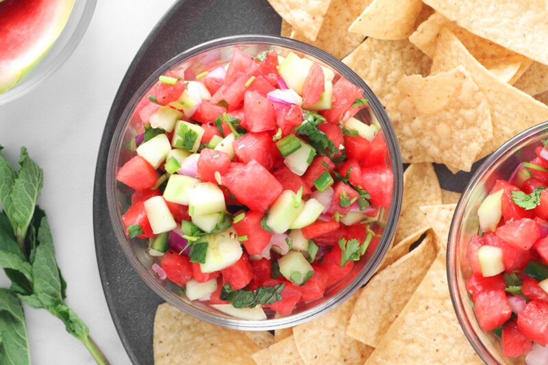Close-up of Watermelon Salsa in a glass bowl with tortilla chips.